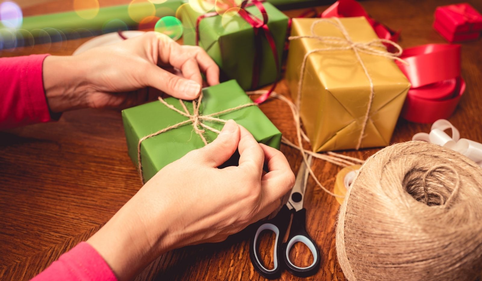 woman wrapping Christmas gifts